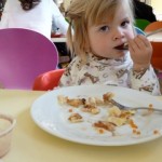 child eating seafood